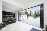 4 part bi folding door set, sprayed in a Grey / Black (Ral 7021 helps deliver the modern and contemporary space that our customer required