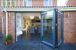 Kitchen renovation with 3 part bi folding door set. With our reassessed running track the decking was brought up to the internal finished floor lever to achieve a virtual flush finish.