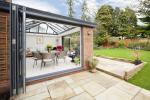 With both sets of doors opening in opposite directions the garden room is dramatically opened onto the garden, giving the owner a wonderful open space when entertaining